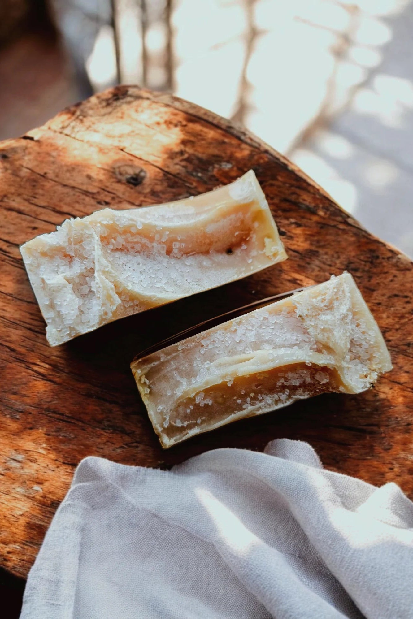 Two 'Citrine' soap bars by Stay Wild Apothecary are shown on a wooden surface