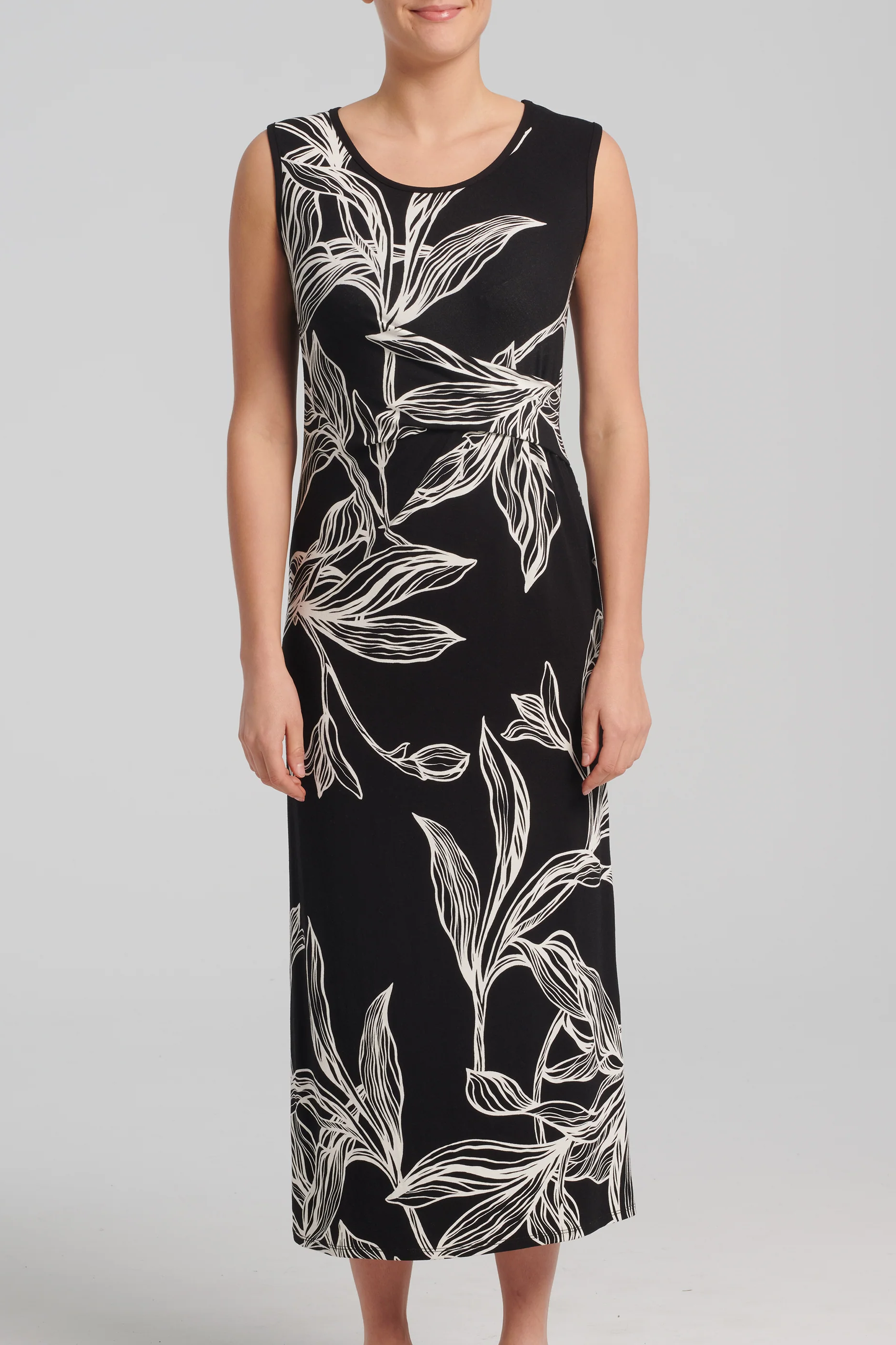 Hemera Dress by Kollontai, Black and White leaf print, sleeveless, round neck, straight cut, pleats at waist, midi-length, sizes XS to XXL, made in Montreal 
