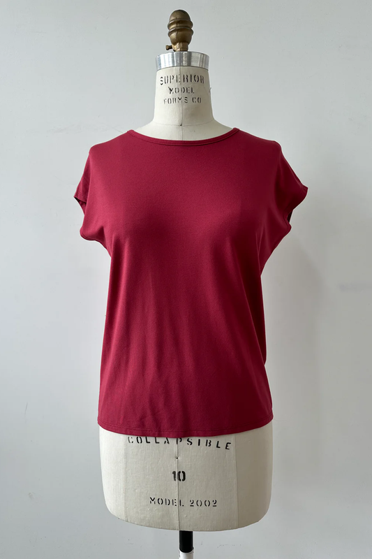 The Eowyn T-Shirt by Kollontai in Raspberry is shown on white mannequin against a white background 