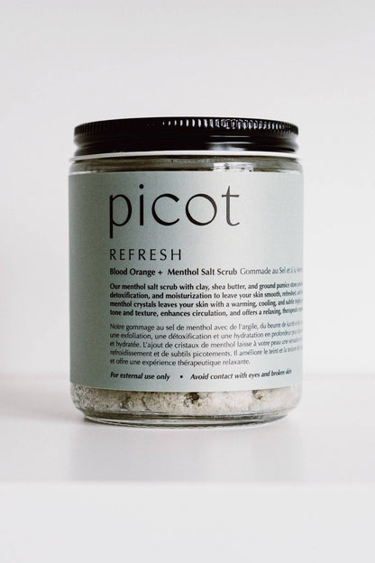 Jar of picot Refresh salt scrub on a white background