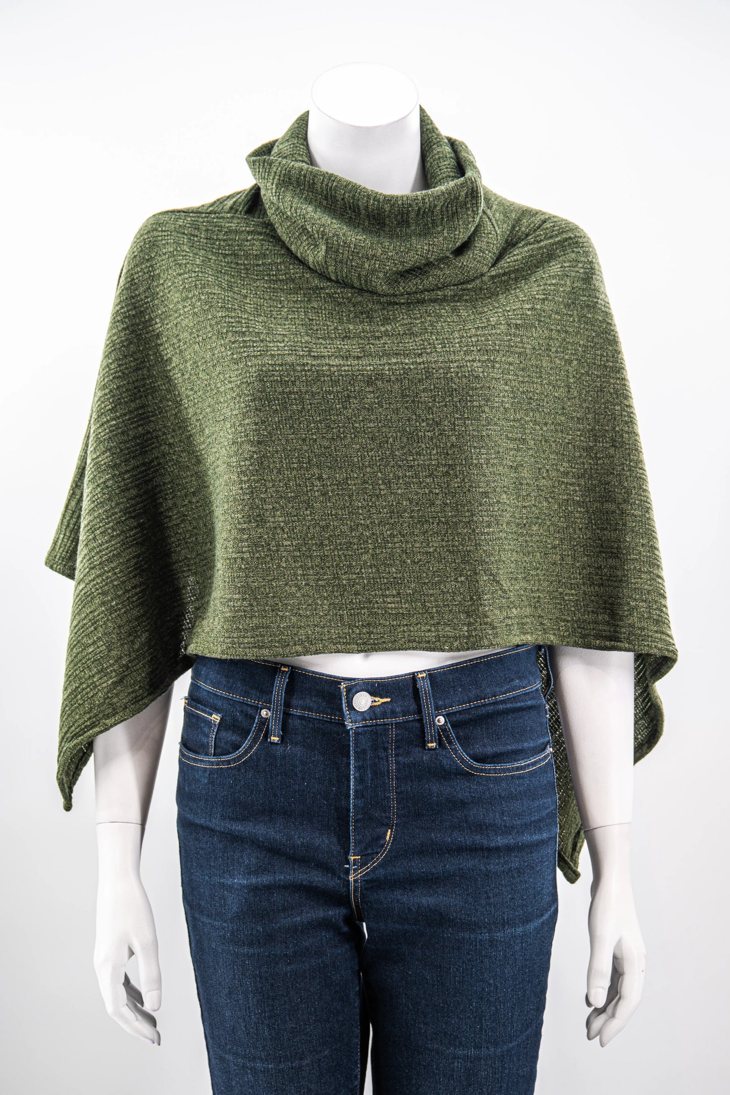 The winter Poncho by Karkass in Green, with a large turtleneck and angled hem, is shown on a mannequin against a white background