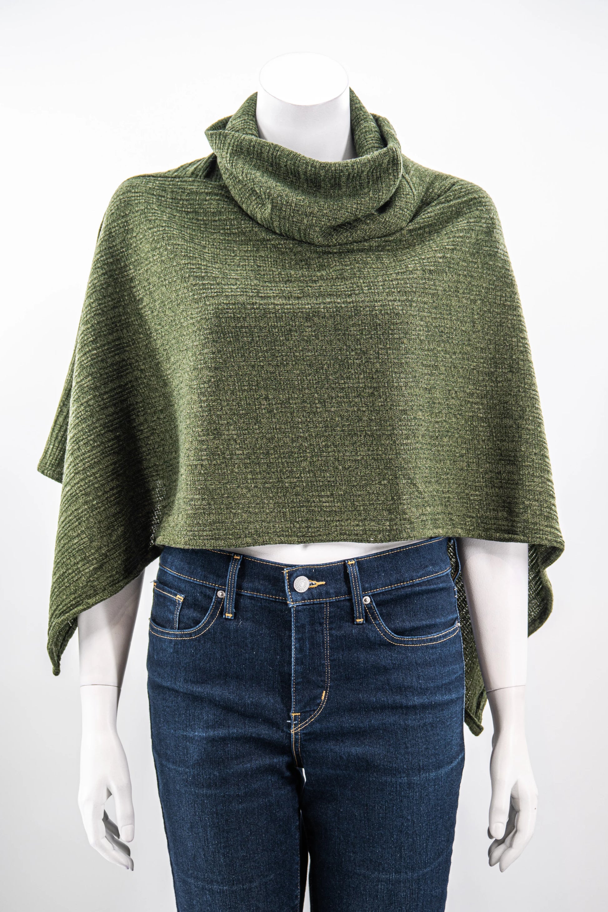 The winter Poncho by Karkass in Green, with a large turtleneck and angled hem, is shown on a mannequin against a white background