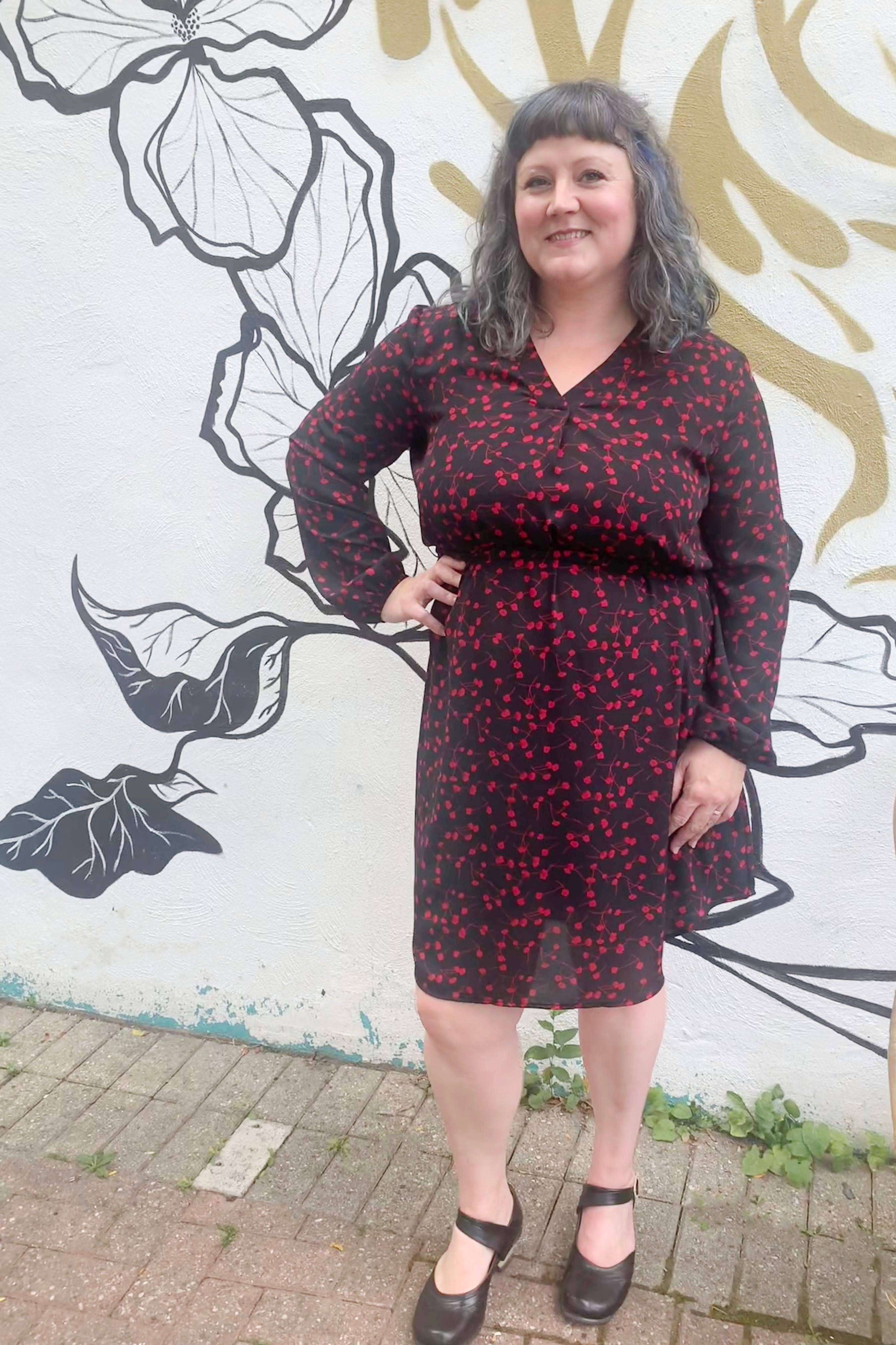 Rosehip Dress by Compli K, Red Floral, black slip dress underlayer, sheer floral overlay, V-neck with placket, long sleeves with gathers at wrists, rounded hem, sizes XS to XXL, made in Canada