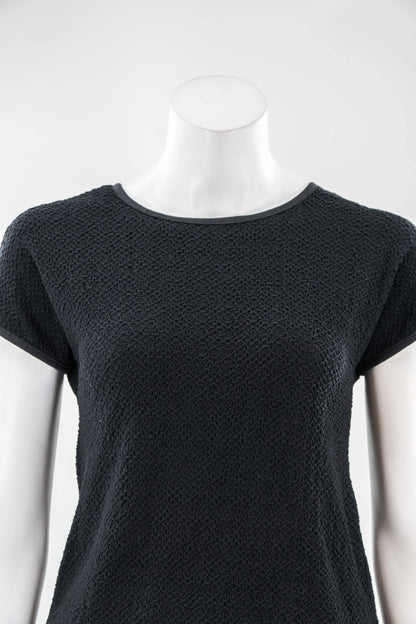 The Onyx T-Shirt by Karkass in Black, in a stretchy 3D textured fabric, is shown on a mannequin with a white background