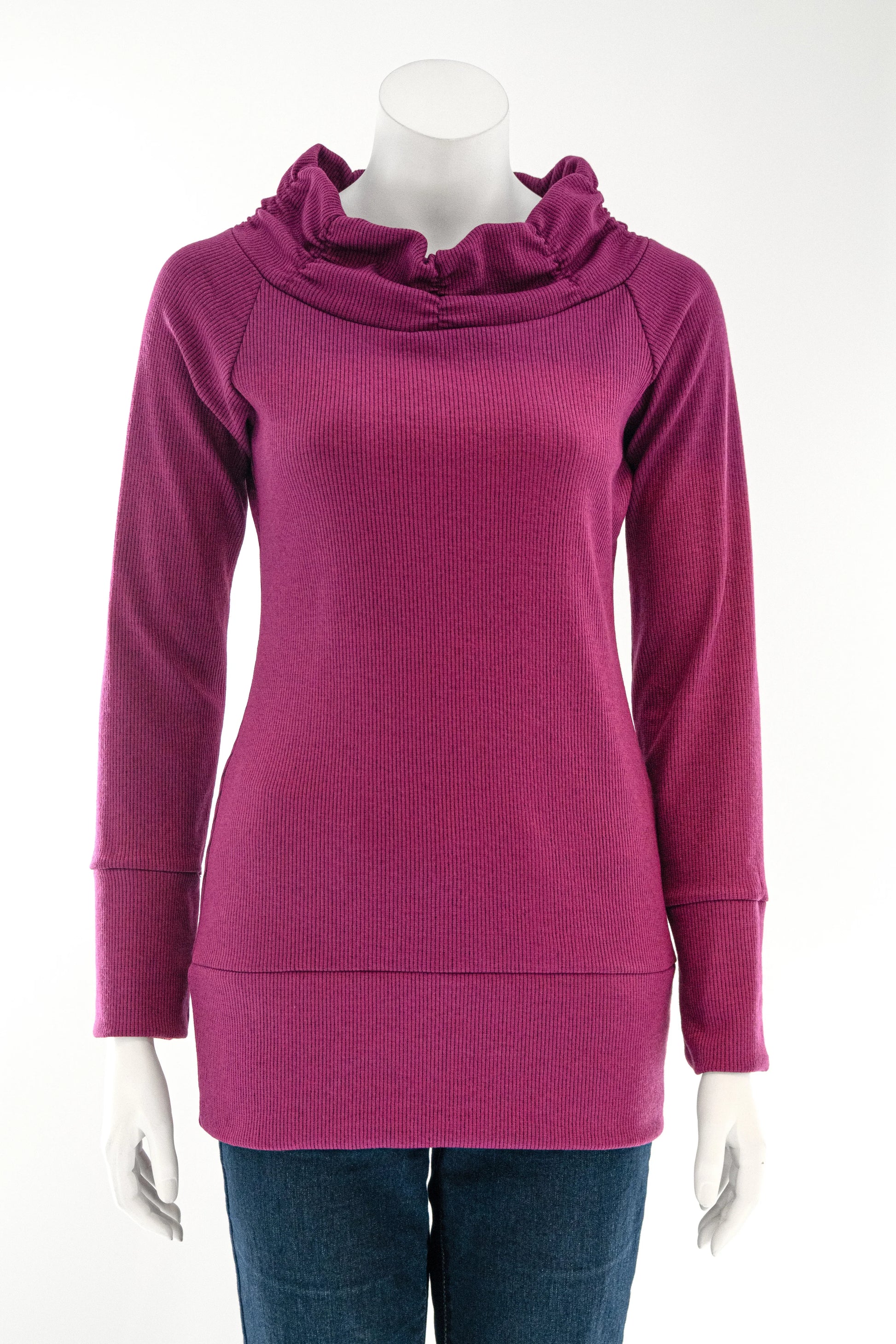 The Myrtille Sweater by Karkass in Purple, with a large pleated cowl neck, long sleeves, and wide band at the bottom is shown on a mannequin against a white background. 