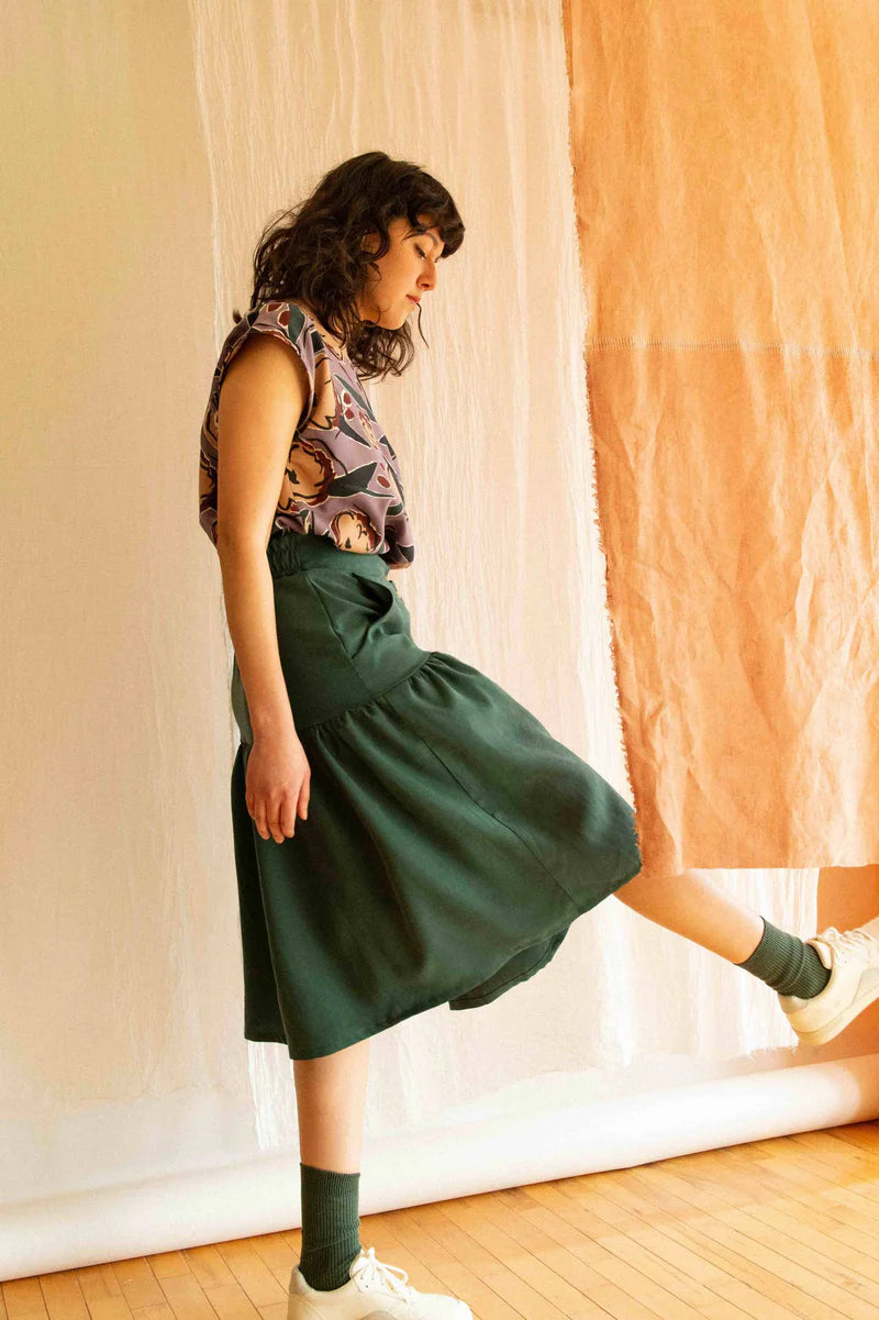 Campanule Skirt by Kazak, Forest Green, midi-length, tiered skirt, elastic at back of waist, brass buttons, two pockets, eco-fabric, tencel, OEKO-TEX certified, sizes XS to XL, made in Montreal 
