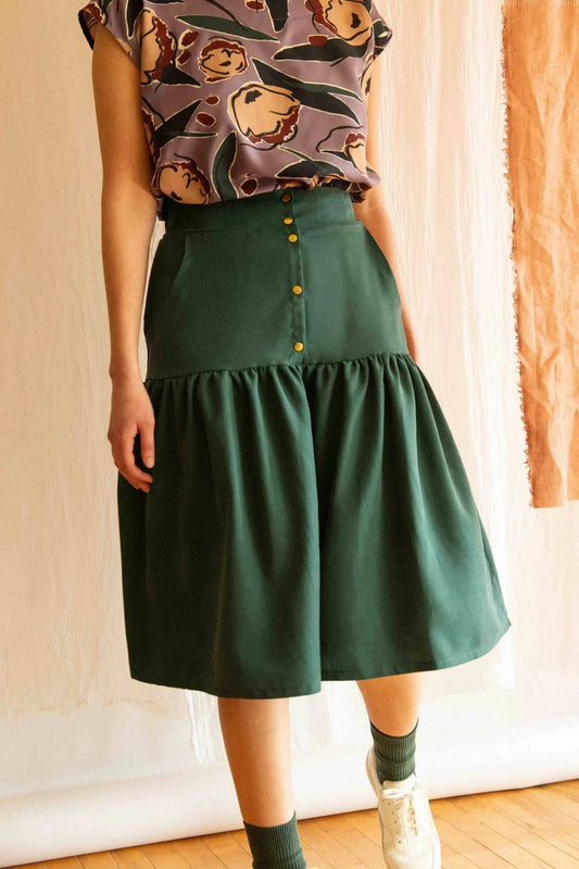 Campanule Skirt by Kazak, Forest Green, midi-length, tiered skirt, elastic at back of waist, brass buttons, two pockets, eco-fabric, tencel, OEKO-TEX certified, sizes XS to XL, made in Montreal 