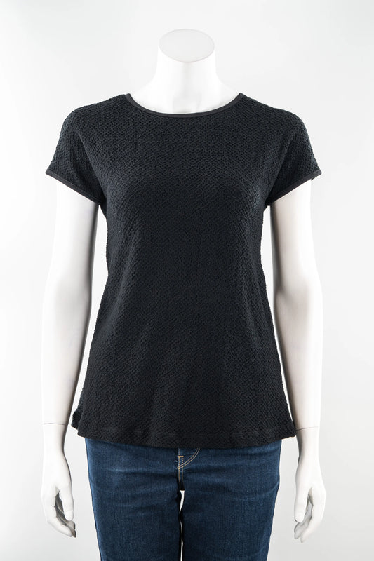 The Onyx T-Shirt by Karkass in Black, in a stretchy 3D textured fabric, is shown on a mannequin with a white background
