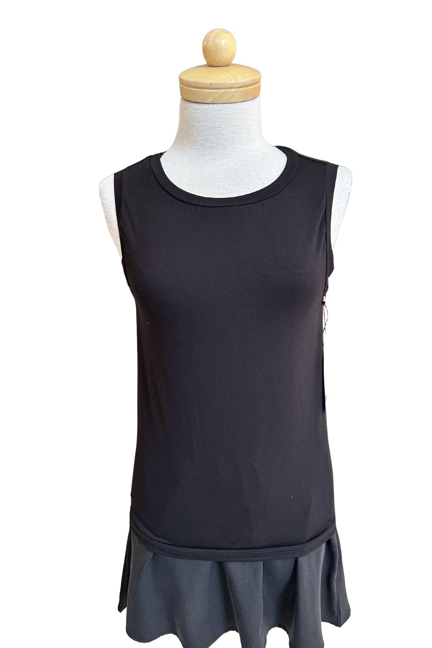 The Neon Camisole by Slak in Black, a high necked, wide strapped tank, is shown on a mannequin with a black skirt against a white background.