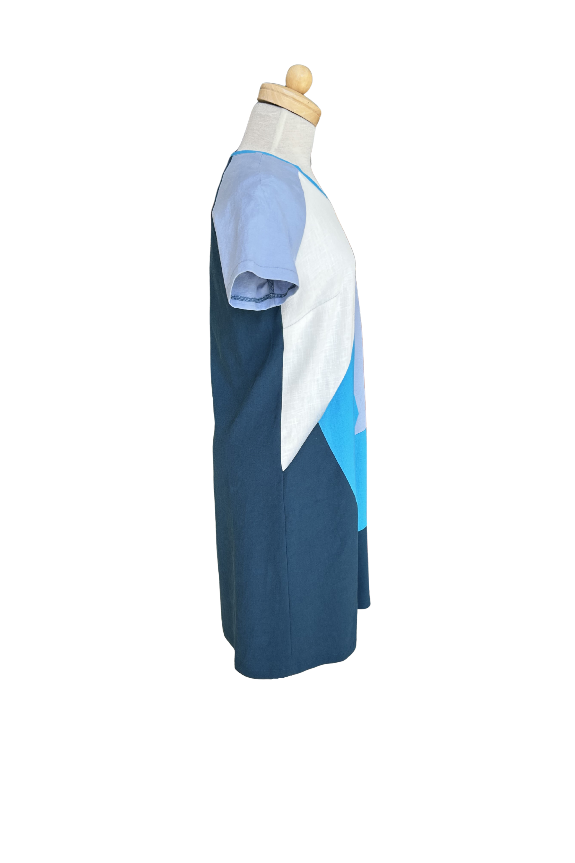 A side view of the Victoria Dress by Solomia is shown on a mannequin against a white background. 