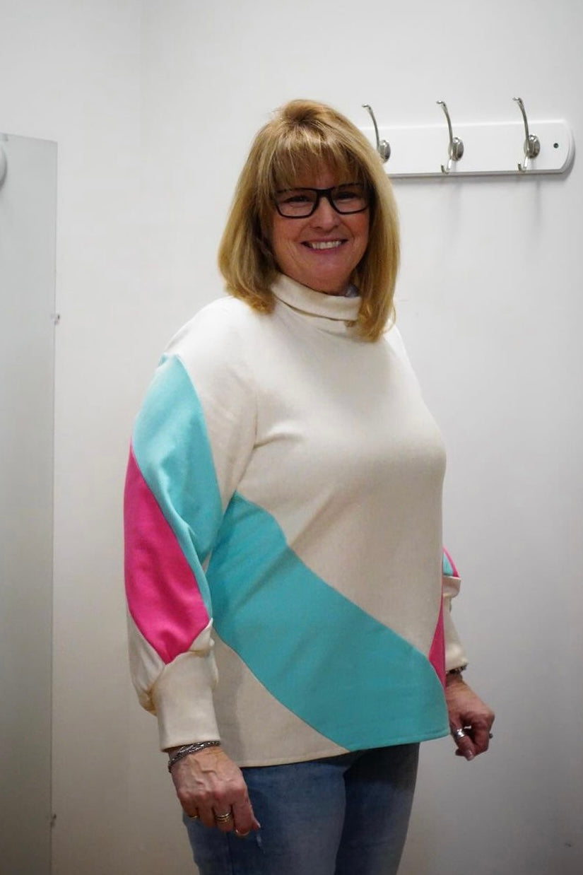 Rosa Sweater by Solomia Design, Cream/Ruby/Aqua, turtleneck, colour-blocked panels, long slightly puffed sleeves with angled cuffs, eco-fabric, bamboo and cotton, sizes XS to L, made in Carleton Place