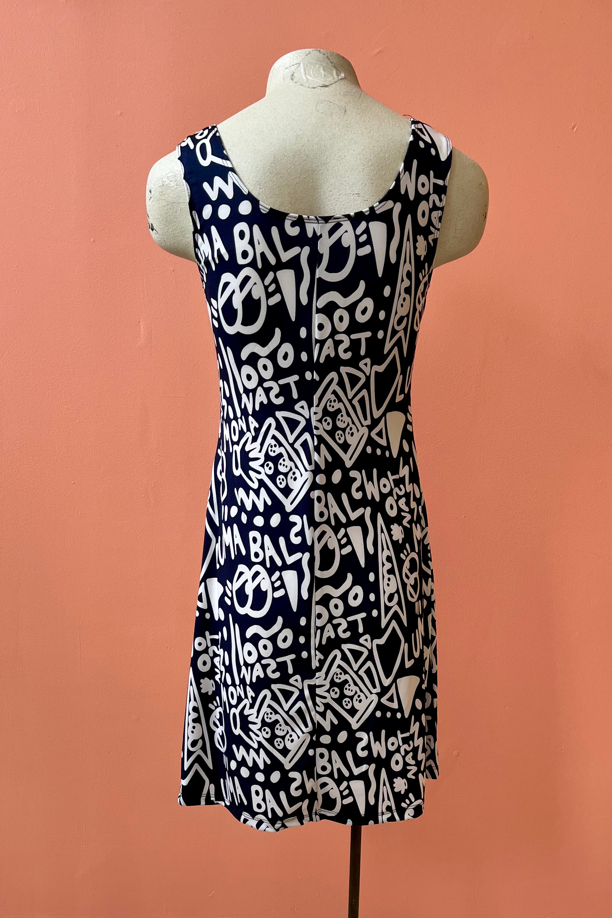 Phillips Dress by Yul Voy, black and white graffiti print, back view, scooped neck front and back, tank dress, wide straps, fit and flare shape, above the knee, sizes XS to XXL, made in Montreal
