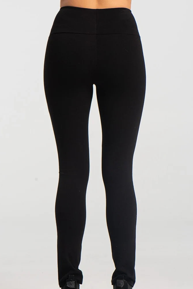 A back waist down view of the Ella Pants from Kollontai in Black, slim pants with a wide pull on waistband, are shown against a grey background. 