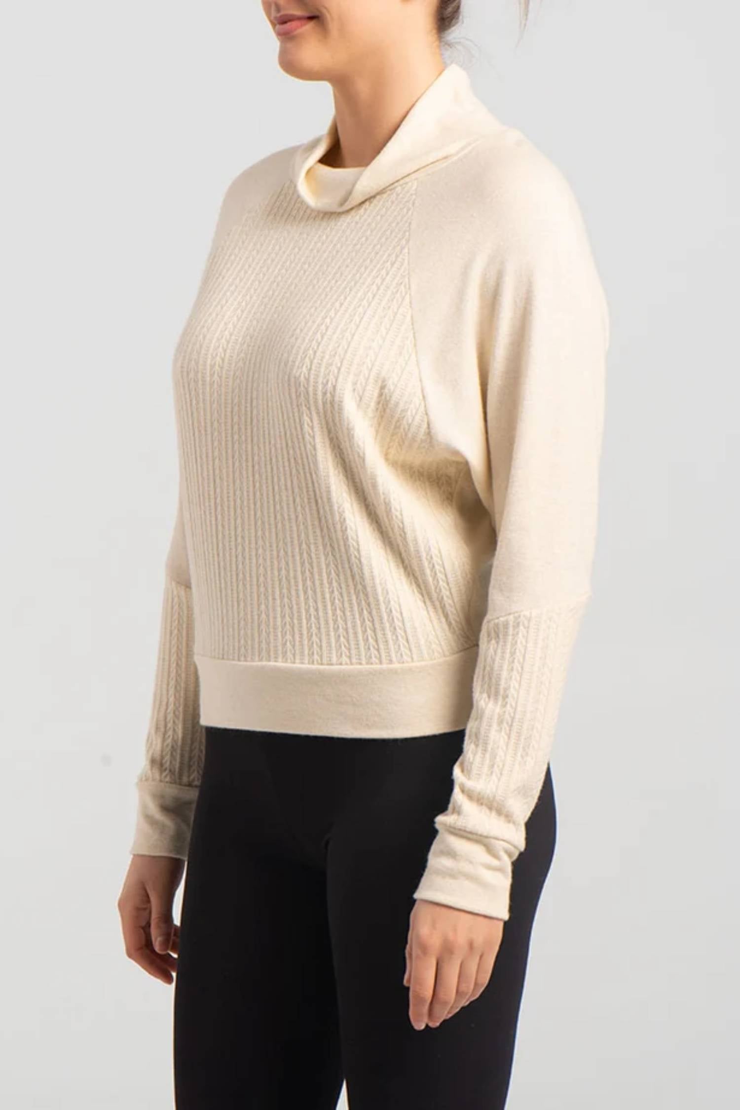 Seth Sweater by Kollontai, Cream, cowl neck, raglan sleeves, fine cable knit on lower sleeves and front, hip length, sizes XS to XXL, made in Montreal