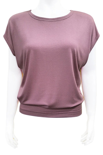 The Mandala Charlie Slouch Tee in Dusty Mauve, with a round neck, short extended sleeves, and a fitted hem, is shown on a mannequin against a white background. 