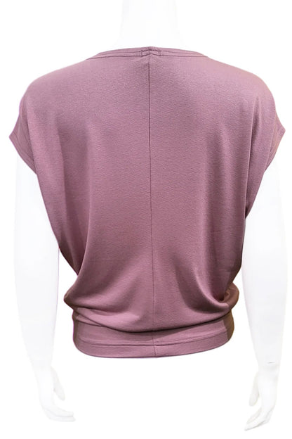 A back view of the Mandala Charlie Slouch Tee in Dusty Mauve is shown on a mannequin against a white background.