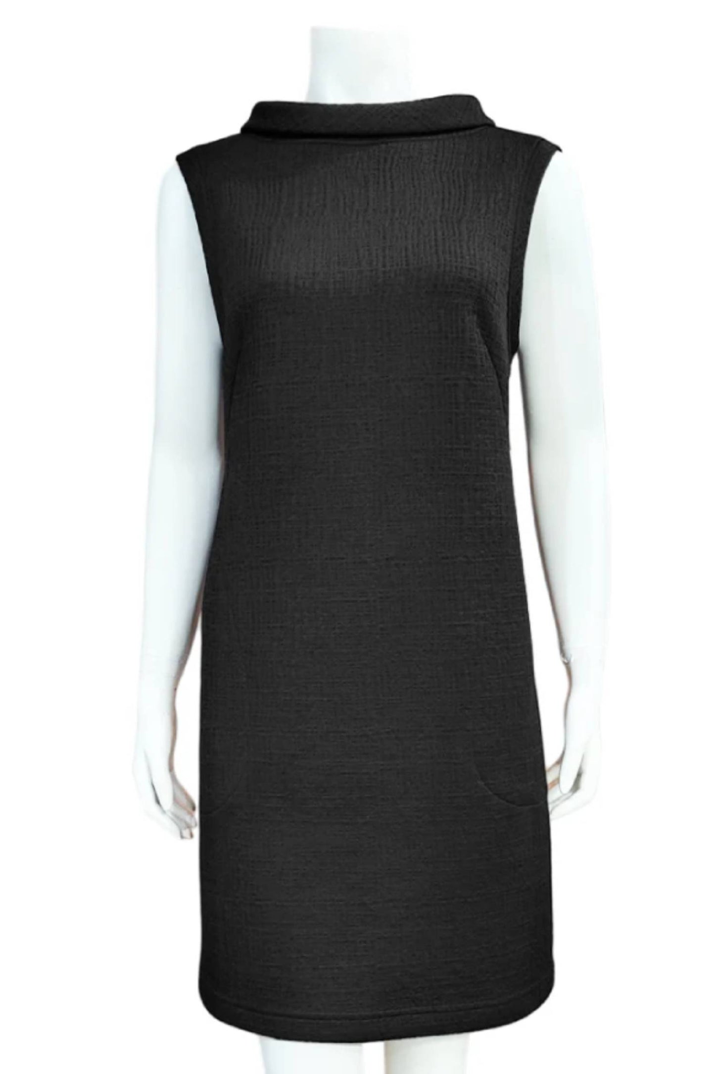 Mandala's Linus Jacquard Tunic in Black, a sleeveless piece featuring a roll collar, French darts, and pockets, is shown on a mannequin against a white background. 