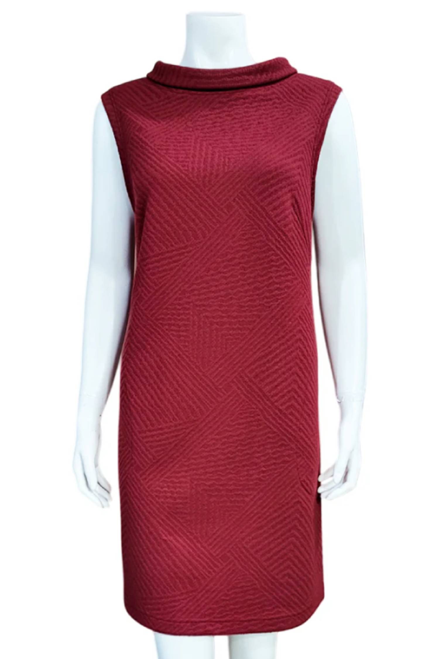 Mandala's Linus Jacquard Tunic in Red, a sleeveless piece featuring a roll collar, French darts, and pockets, is shown on a mannequin against a white background. 