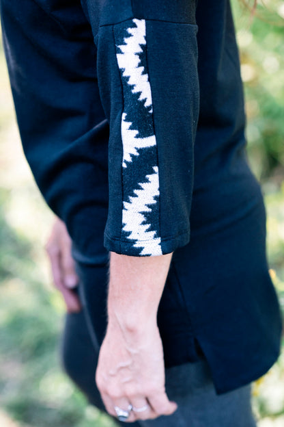 Close up detail of the sleeve fabric of the Marie C Tunic Java in Black 