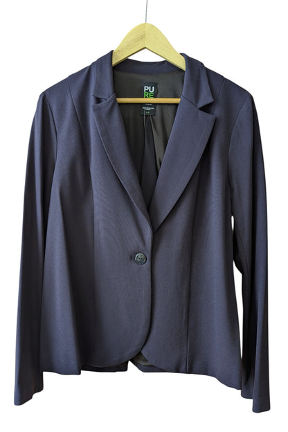 The Famke Jacket by Pure Essence in in Navy, a single breasted blazer with a single button closure, is shown hanging on a wall in front a white background. 