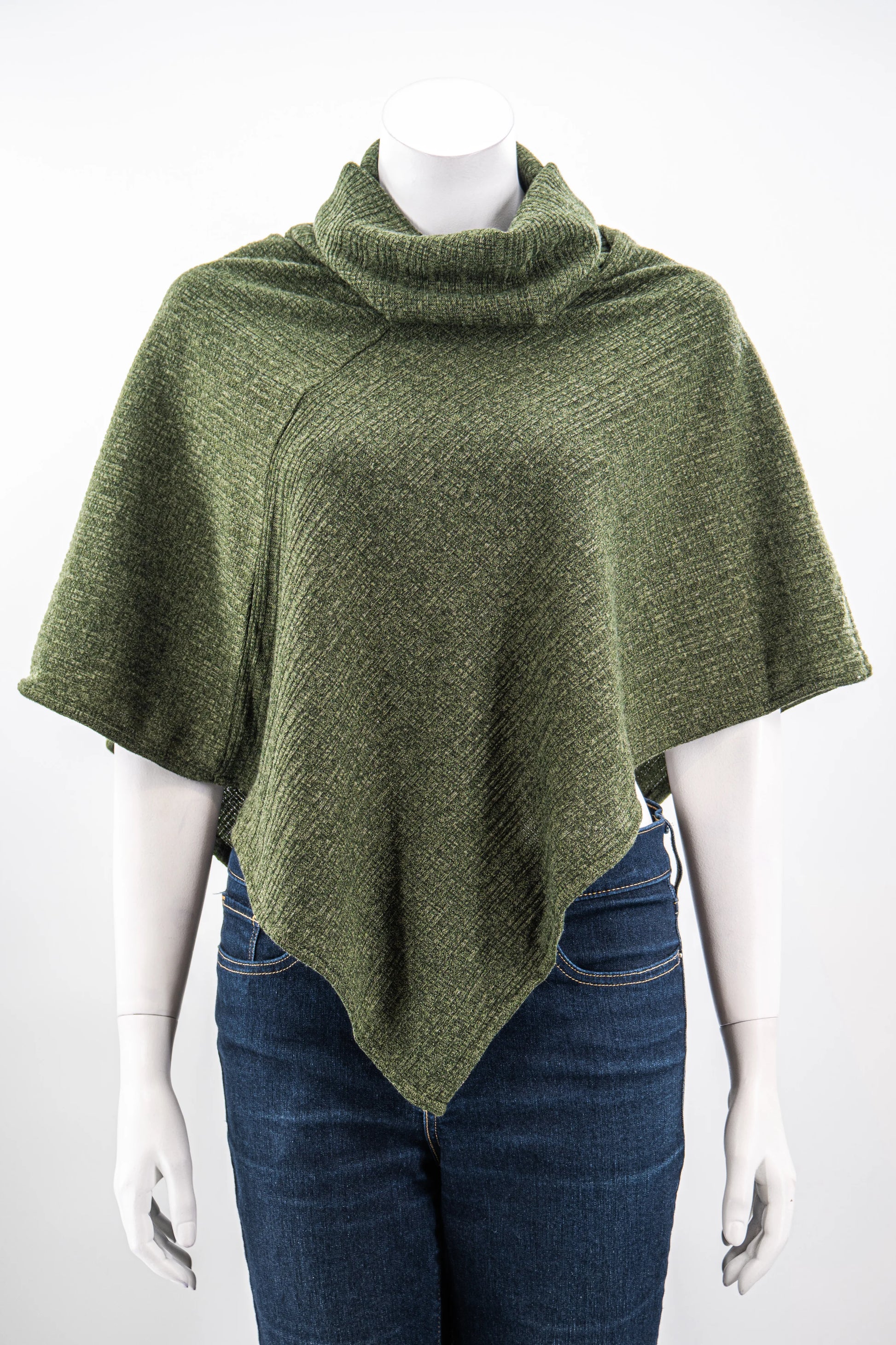 The winter Poncho by Karkass in Green, with a large turtleneck and angled hem, is shown on a mannequin against a white background