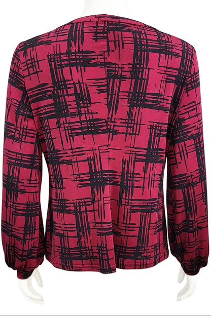 A back view of the Gwen Blouse by Mandala in Hopscotch - Cherry print is shown on a mannequin against a white background.