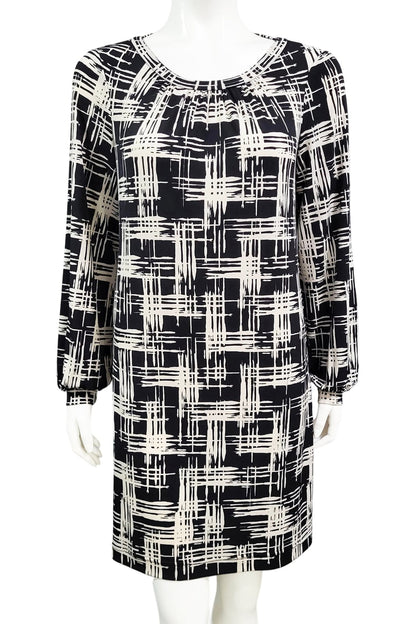 The Gwyneth mini dress from Mandala in Hopscotch - Black is shown on a mannequin against a white background 