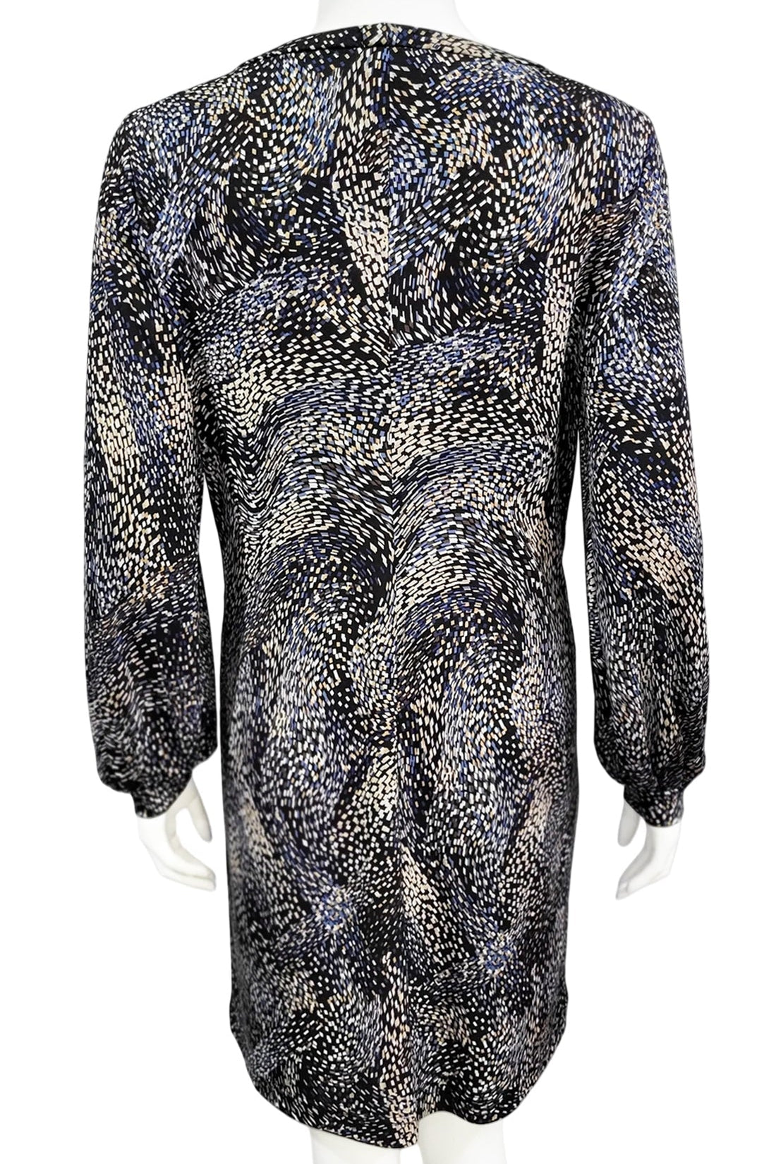 A back view of the Gwyneth mini dress from Mandala in Starry Night - Blue is shown on a mannequin against a white background 