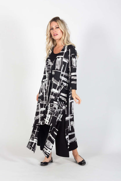 A woman wearing the Cyrus Duster by Pure Essence in Black/White Pattern, standing in front of a white background 