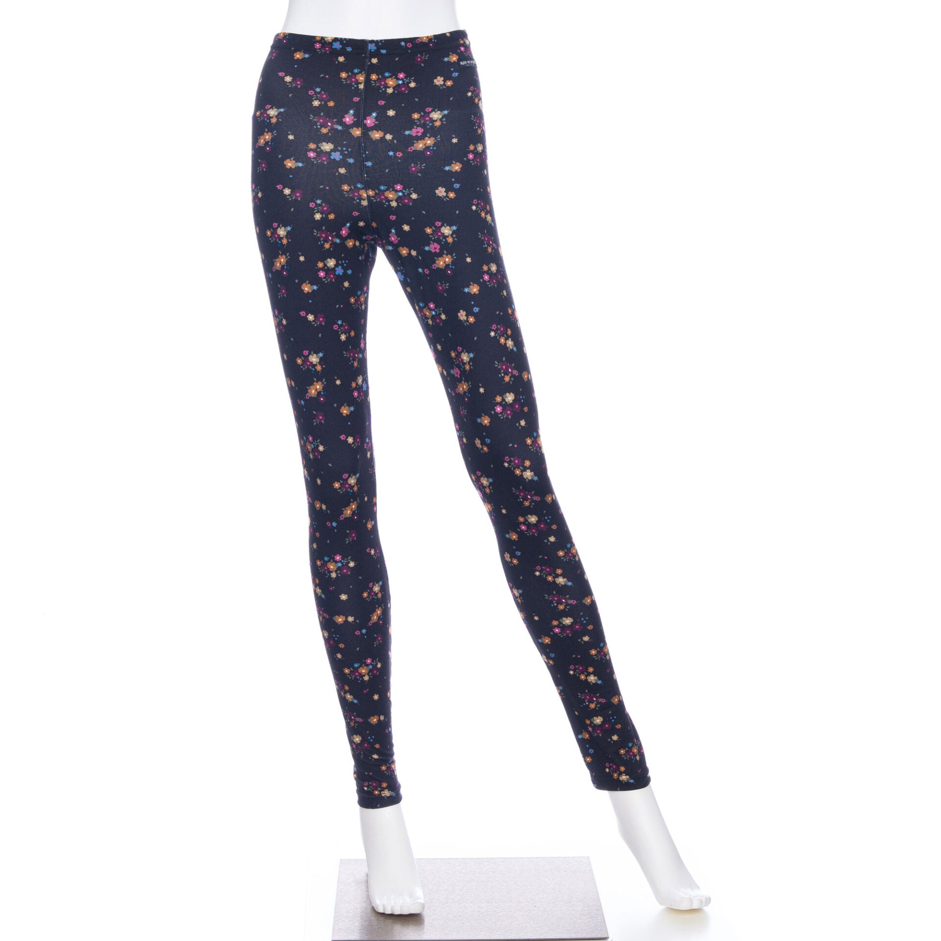 The Laracin Leggings by Rien ne se Perd in a small Floral print are shown on a mannequin in front of a white background. 