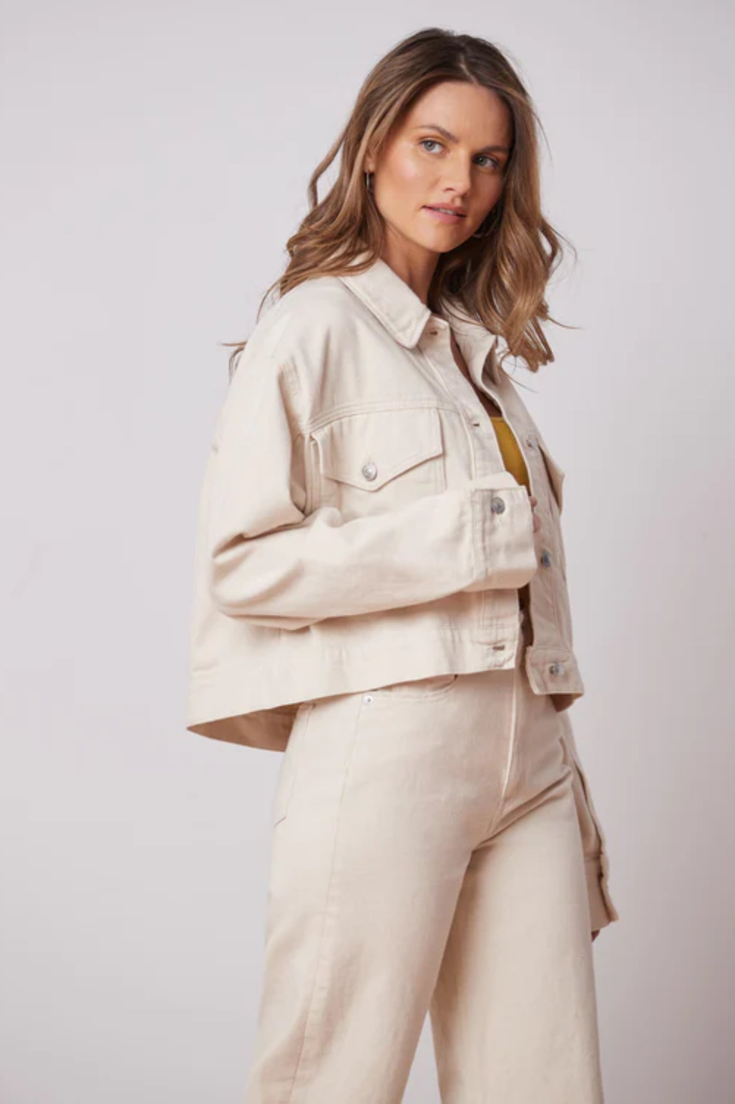 Oversized Off-White Denim Jacket by Yoga Jeans, oversized, cropped fit, button front, front pockets with buttons, 100% cotton, sizes XS to XL, made in Canada