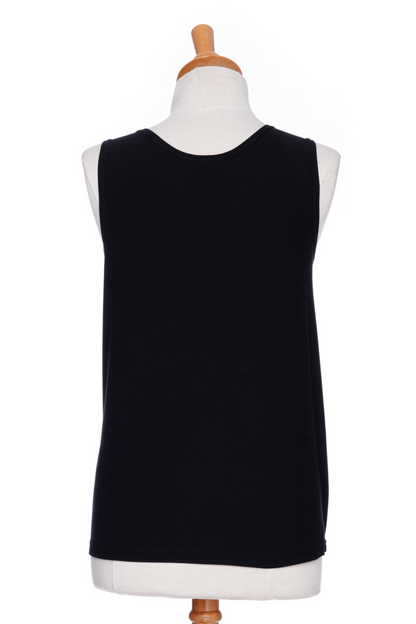 A back view of the Spritz Tank Top by Rien ne se Perd in Black, with wide straps and side slits, is shown on a mannequin in front of a white background 