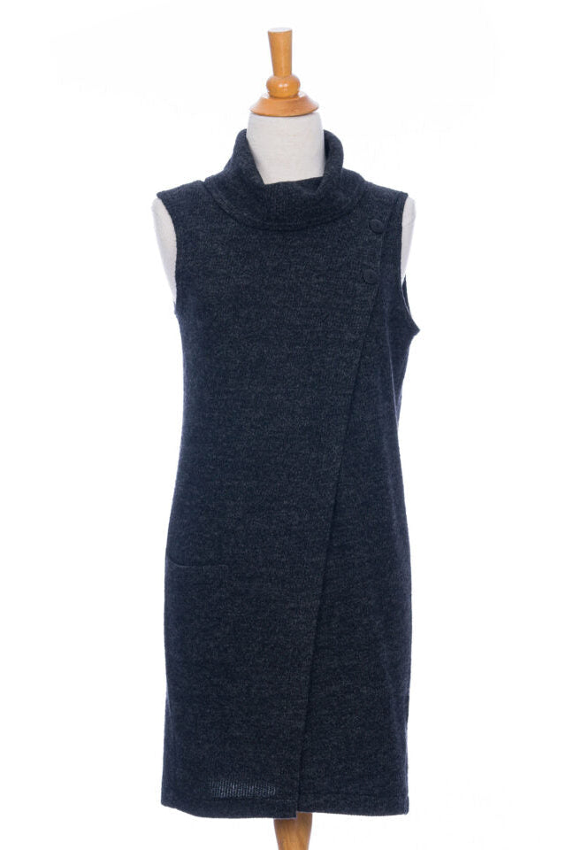 The long Baumier Vest by Rien ne se Perd in Charcoal, with a cowl neck, overlapping front, buttons and the shoulder and a patch pocket, is shown on a mannequin against a white background. 