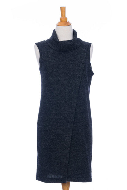 The long Baumier Vest by Rien ne se Perd in Charcoal, with a cowl neck, overlapping front, buttons and the shoulder and a patch pocket, is shown on a mannequin against a white background. 