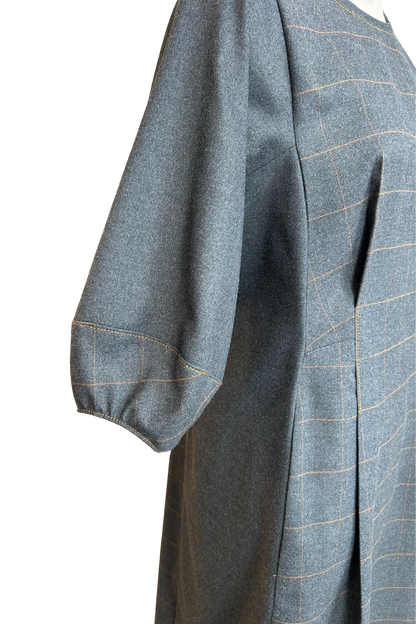 Close up of the structured cuff detail on the Hanna dress by Solomia in Grey.