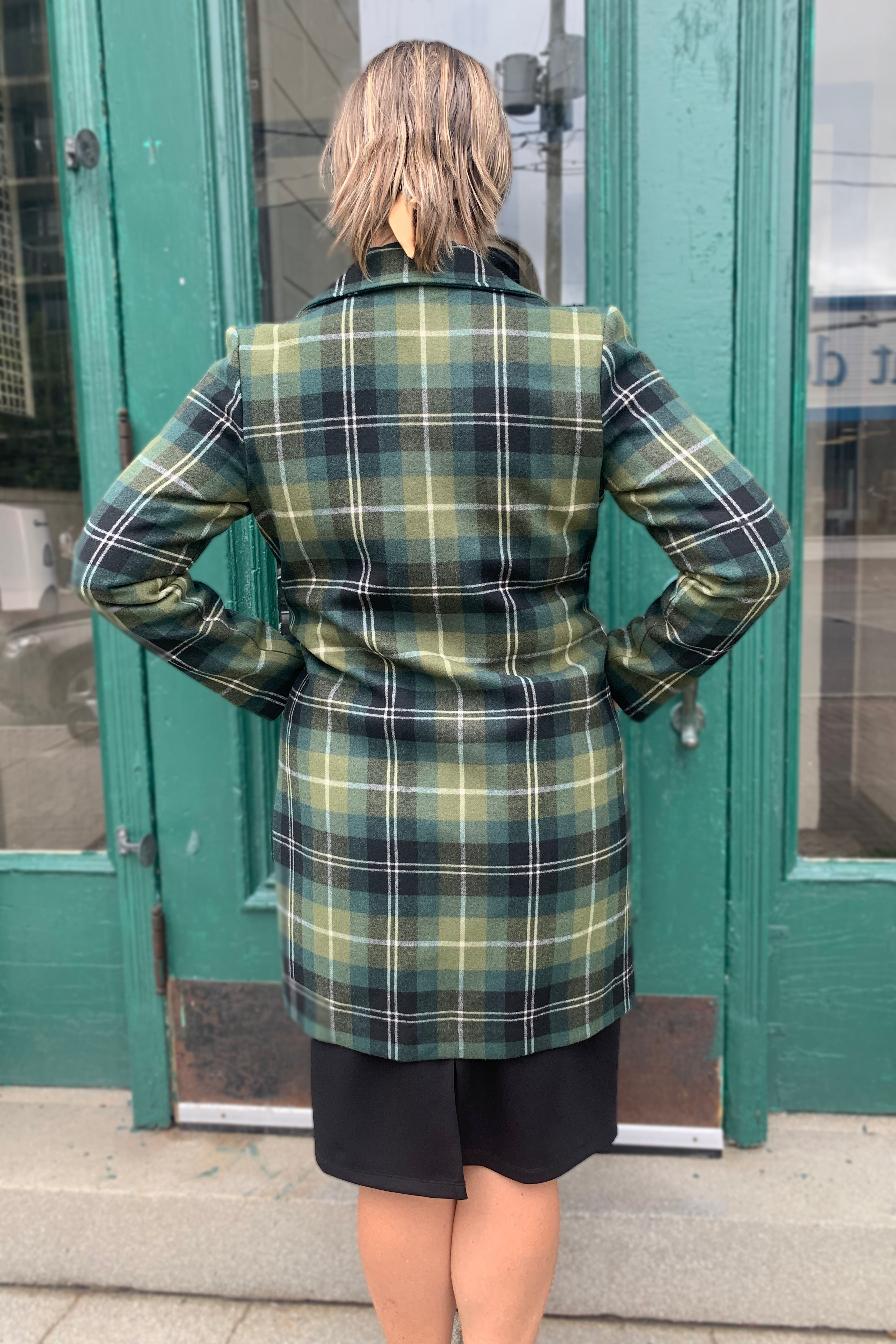 Sybille Coat by Luc Fontaine, Green, back view, wide lapels, buttons up the front, pockets, above the knee, sizes 4-16, made in Canada