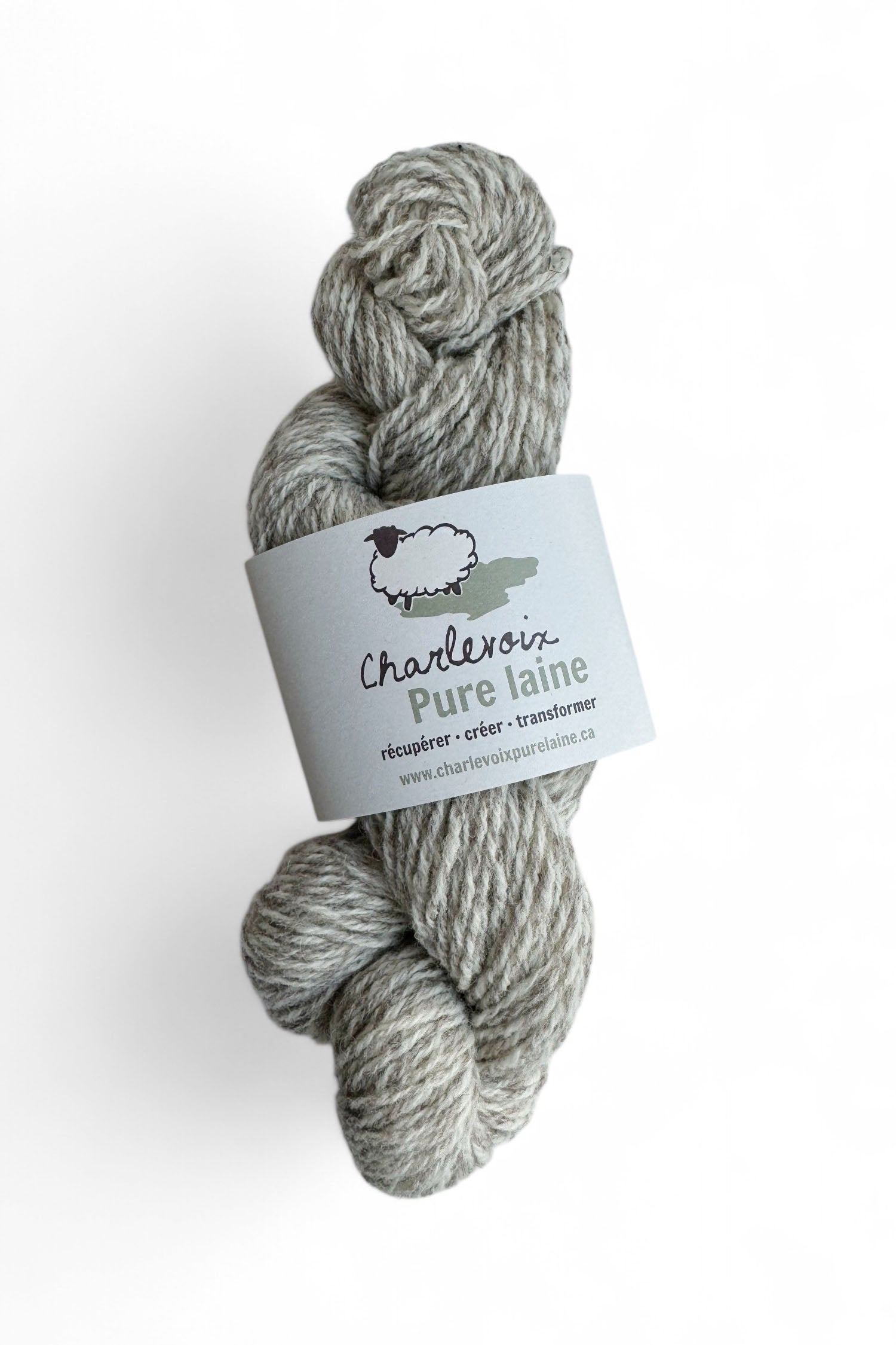 A skein of Natural and Grey yarn from Charlevoix Pure Laine is shown against a white background 