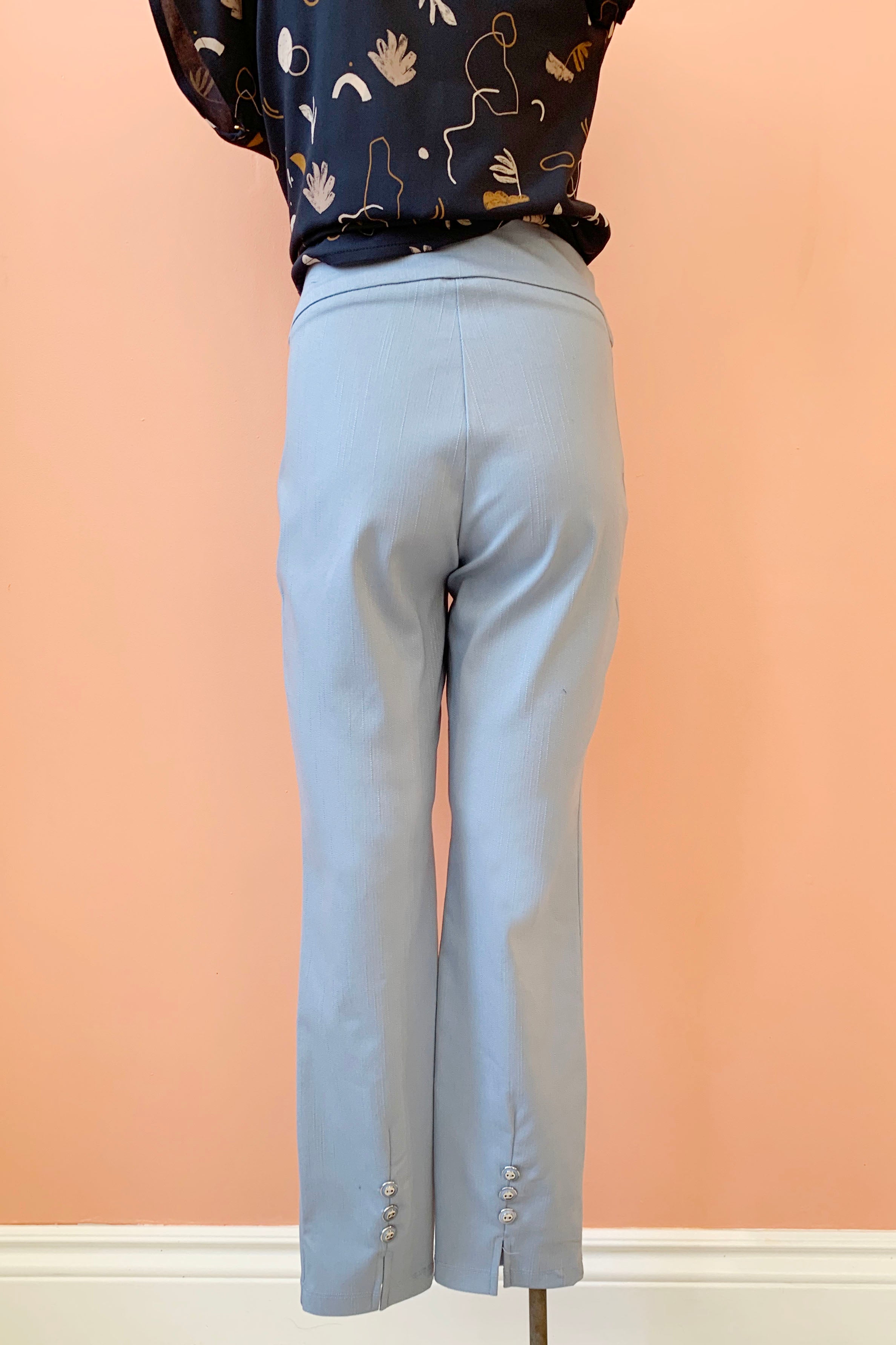 Otto Pants by Pure Essence, Blue, back view, pull-on, wide waistband, triple button and slit detail at back leg hems, sizes XS to XXL, made in Canada