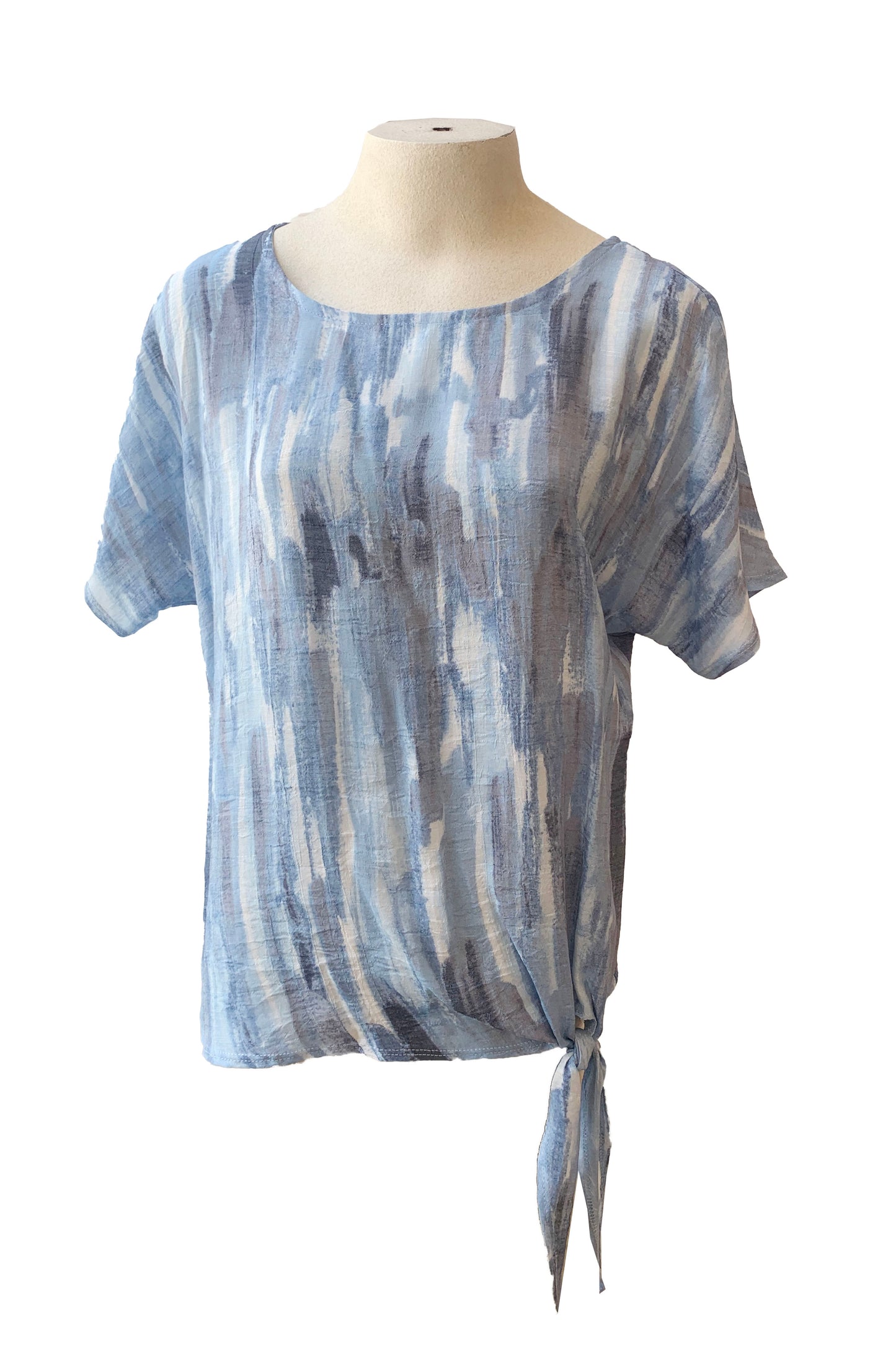 The Chanelle Top by Pure Essence in Sky/Blue is shown on a mannequin in front of a white background