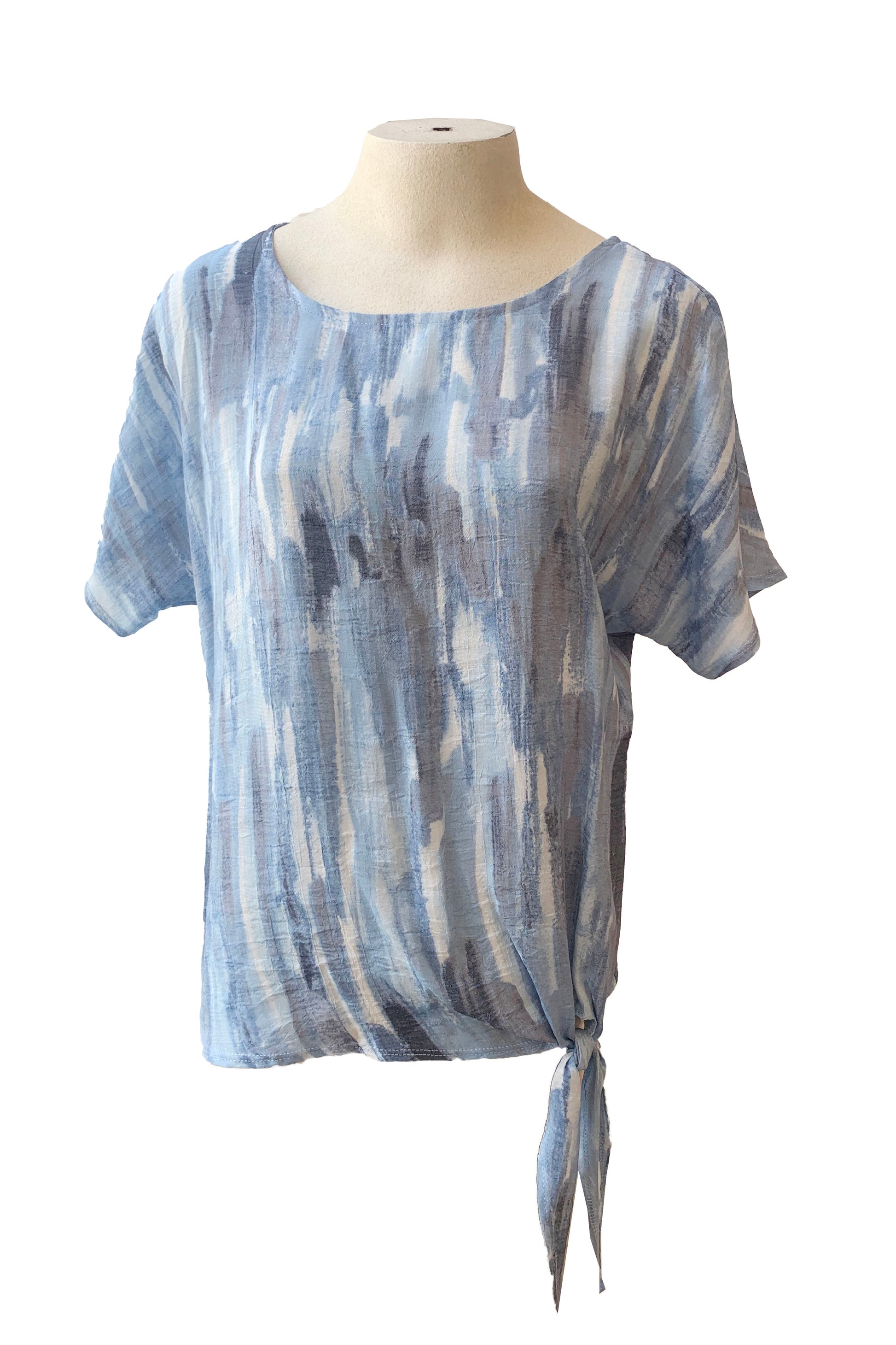 The Chanelle Top by Pure Essence in Sky/Blue is shown on a mannequin in front of a white background