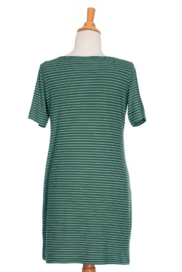 A back view of the Boogie Dress by Rien ne se Perd in Green/White Stripe, a t-shirt dress with a wide neck, side pocket, and slit and coconut button detail on the short sleeves, show on a mannequin in front of a white background. 